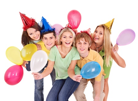 Group of young people in party hat holding balloon. Isolated.の写真素材