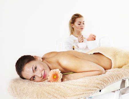 Young beautiful woman on massage table in beauty spa. Series.の写真素材