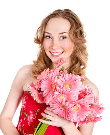 Happy young woman lying on flowers.の写真素材