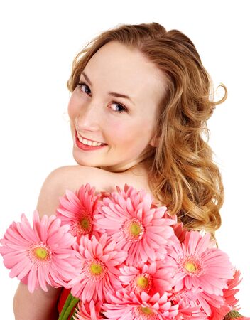 Happy young woman holding  flowers. Isolated.の写真素材