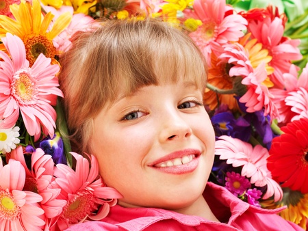 Little cute girl lying  on  flower.の写真素材