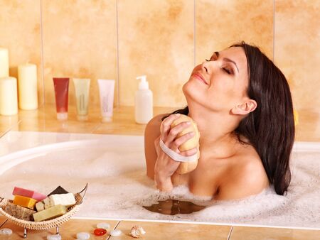 Young woman take bubble  bath.の写真素材