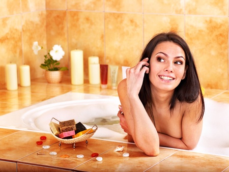 Young woman take bubble  bath.の写真素材