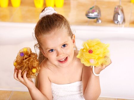 Child washing in bubble bath .の写真素材