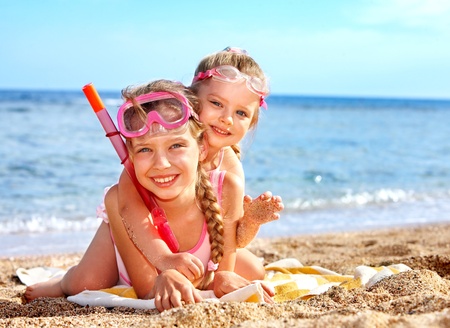 Children playing on  beach. Snorkeling.の写真素材