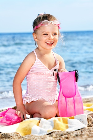 Little girl  playing on  beach.の写真素材