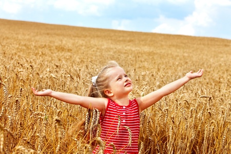 Child in wheat field. Outdoor.の写真素材