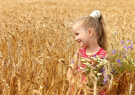 Child in wheat field. Outdoor.の写真素材