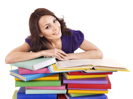 Girl with pile color book . Isolated.の写真素材
