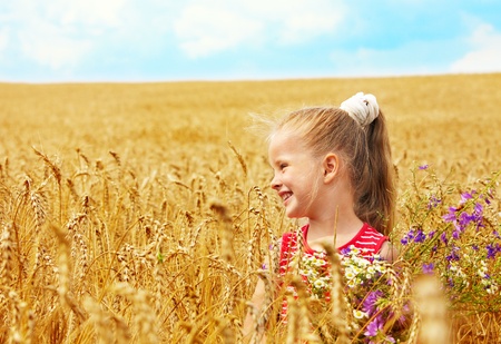 Child in wheat field. Outdoor.の写真素材