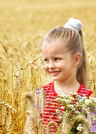 Child in wheat field. Outdoor.の写真素材