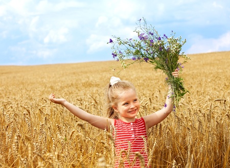 Child in wheat field. Outdoor.の写真素材