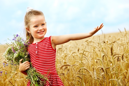 Child in wheat field. Outdoor.の写真素材