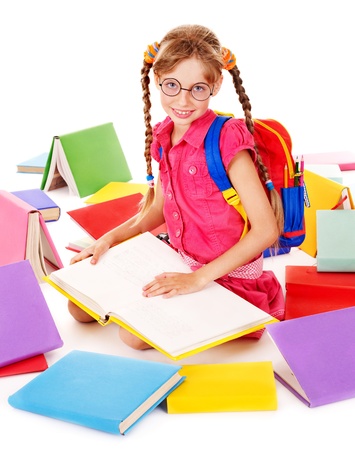 Happy sitting schoolgirl in eyeglasses  with  pile of books. Isolated.の写真素材