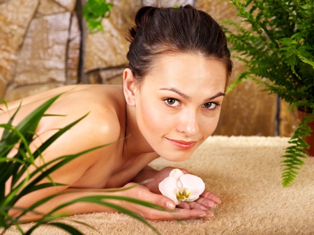 Beautiful young woman getting massage in spa.の写真素材