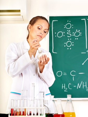 Group chemistry student with flask in classroom.の写真素材