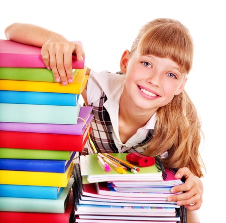 School child holding stack of books.  Isolated.の写真素材