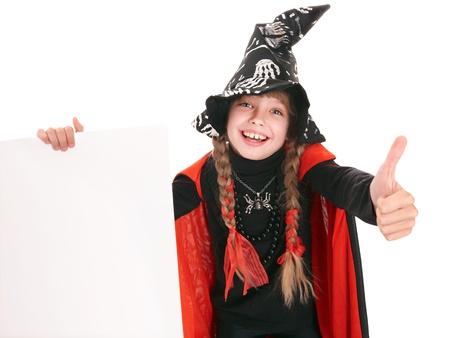Child girl witch in black costume  with thumb. Isolated.の写真素材