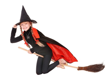 Little girl in costume Halloween witch in black dress and hat fly on broom.Isolated.の写真素材