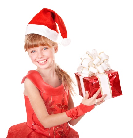 Little girl in santa hat holding red gift box.  Isolated.の写真素材