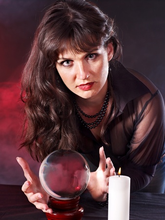 Young woman  with crystal ball. Beauty and fashion.の写真素材