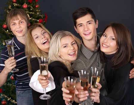 Group young people drink champagne at nightclub.の写真素材