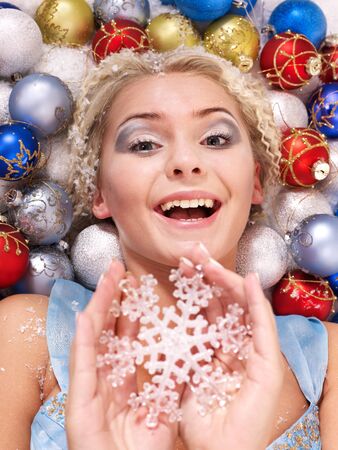 Young beautiful woman in christmas balls.の写真素材