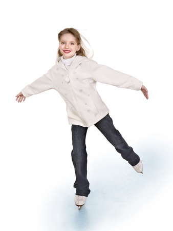 Happy young girl figure skating. Isolated.の写真素材