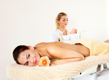 Young beautiful woman on massage table in beauty spa. Series.の写真素材