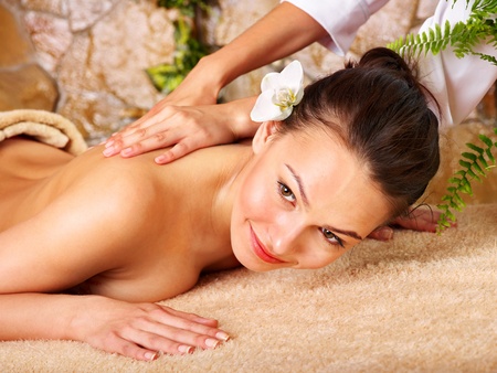 Beautiful young woman getting massage in spa.の写真素材