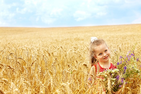 Child in wheat field. Outdoor.の写真素材