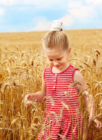Child in wheat field. Outdoor.の写真素材