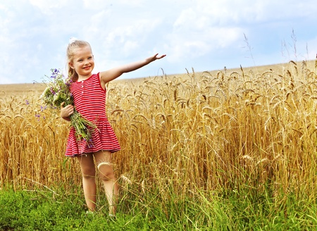 Child in wheat field. Outdoor.の写真素材