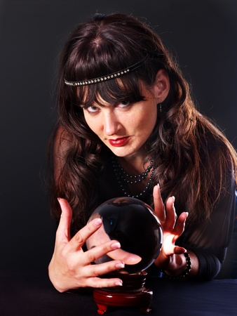 Young woman  with crystal ball. Beauty and fashion.の写真素材