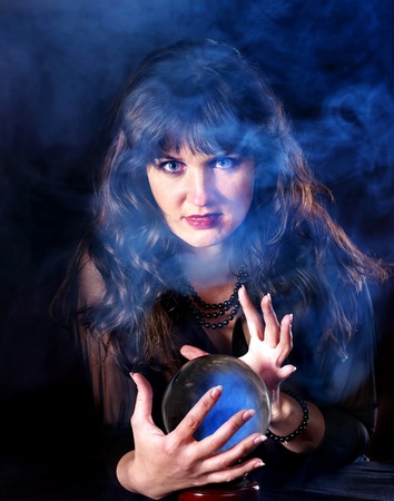 Young woman  with crystal ball. Fortune telling.の写真素材