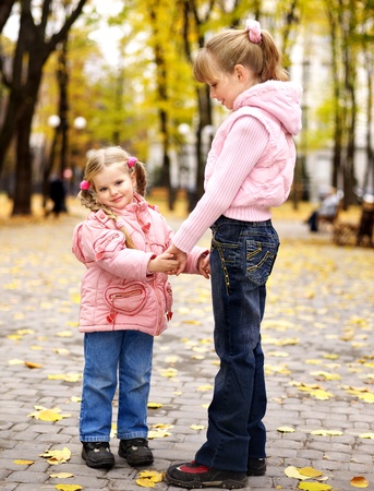 Child in autumn orange leaves. Outdoor.の写真素材