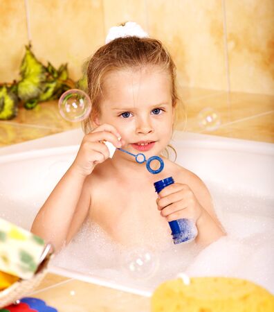 Child washing in bubble bath .の写真素材