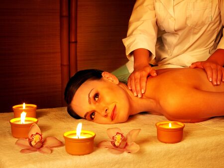 Young beautiful woman on massage table in beauty spa.  Series.の写真素材