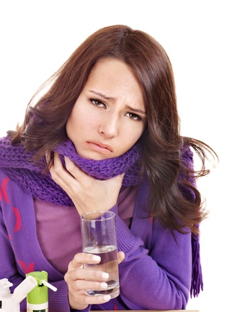 Young woman having flu takes pills.の写真素材