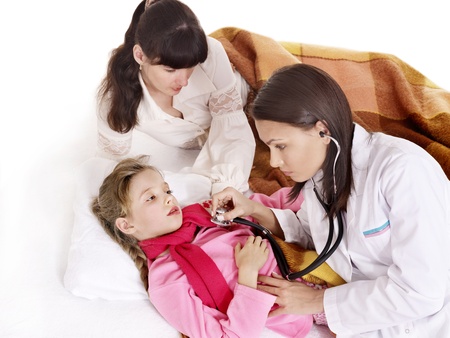 Doctor exams  little girl with stethoscope. Isolated.の写真素材