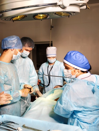 Group of surgeon looking at patient in operation room.の写真素材