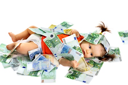 Child with euro money. Business concept.How much it costs to have a baby?の写真素材