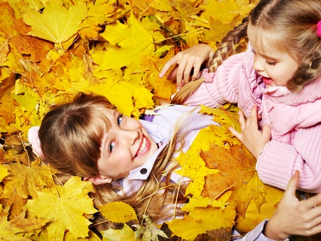 Child in autumn orange leaves. Outdoor.の写真素材