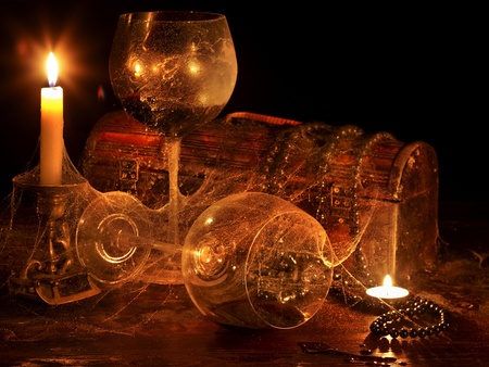 Two wine glass and candle on darkの写真素材