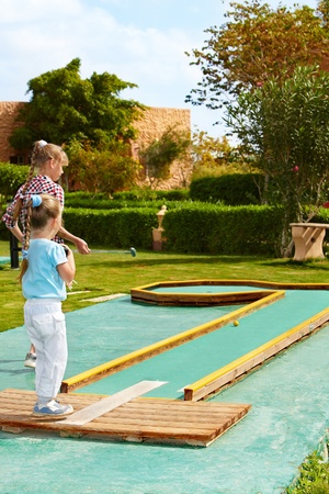 Children playing in golf. Outdoor.の写真素材