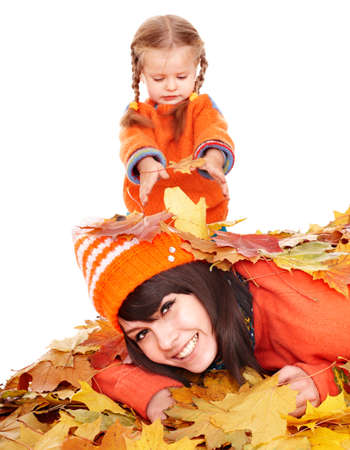 Happy family with child on autumn orangeleaves. Outdoor.の写真素材