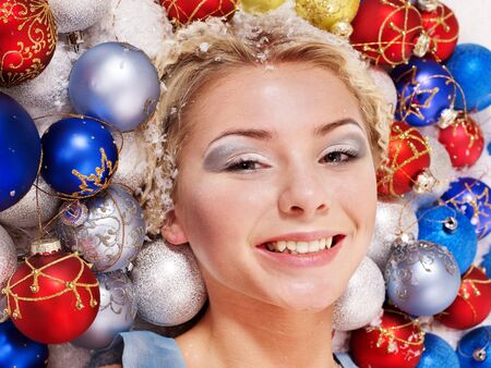 Young beautiful woman in christmas balls.の写真素材