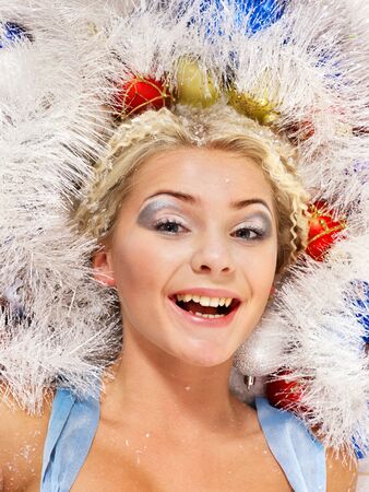 Young beautiful woman in christmas balls.の写真素材
