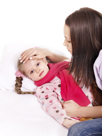 Sick little girl with mother. Isolated.の写真素材