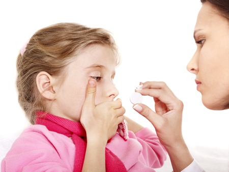 Sick child take  medicine with doctor. Isolated.の写真素材